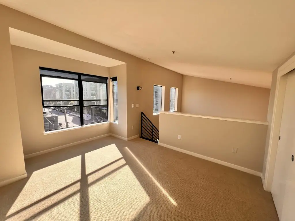 an Francisco apartment alcove with space for a desk and a sliding-door closet suitable for a cloffice home office setup.