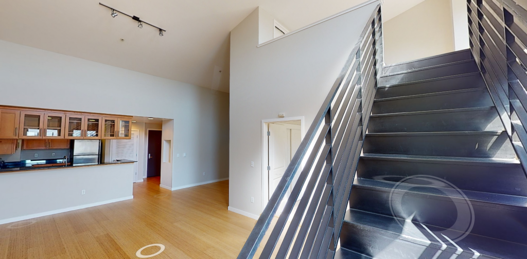View of Boston loft unit from bottom of loft stairs.