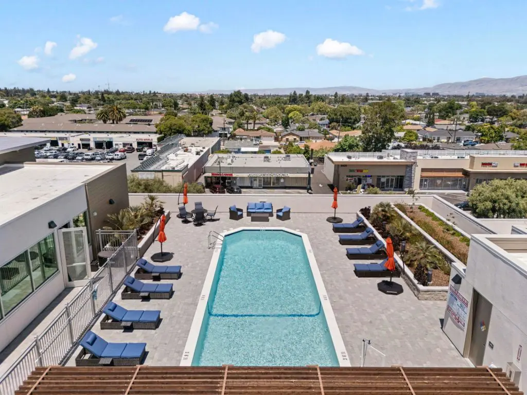 A rooftop pool and coworking space at The Deck in Santa Clara serve as top-tier luxury amenities for its tech professional residents.