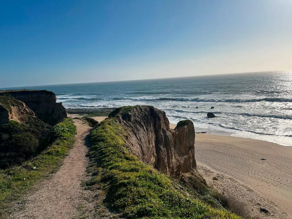 Coastal hiking trail overlooking the Pacific Ocean near Half Moon Bay, California.
