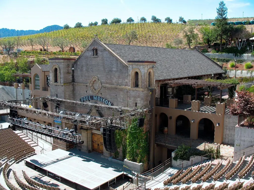 The Mountain Winery amphitheater and historic Paul Masson winery overlooking hillside vineyards in Saratoga, California.