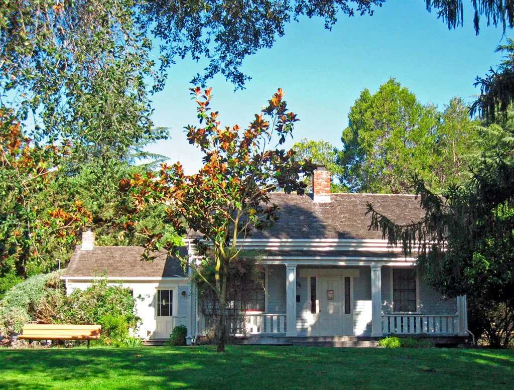 Historic Scott House surrounded by mature trees and greenery in Scotts Valley, California.