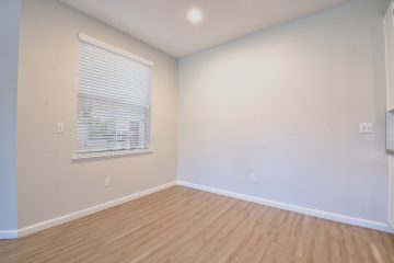 Room with window & recessed lighting.