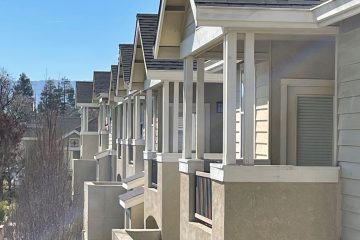 A row of apartment unit patio balconies.