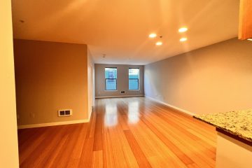 Boston Den Living Room area with two windows.