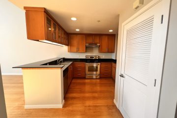 Boston kitchen with brown cabinets and stainless steel appliances.