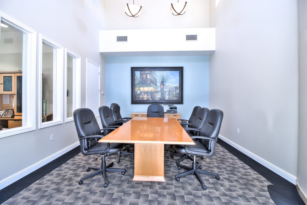 A modern meeting room at Catalina luxury Apartments makes a great coworking-friendly space for remote professionals
