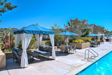 Outdoor pool with seating & shaded canopy