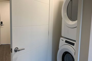 washer and dryer unit in nexus on 9th apartment interior