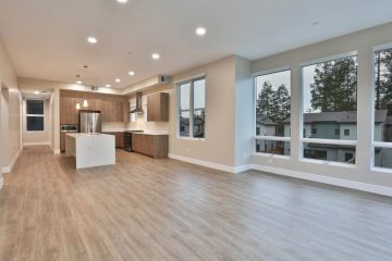 Apartment Living Room View of Kitchen and Windows