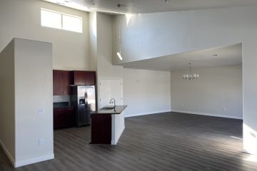 Apartment unit open floor plan with kitchen island