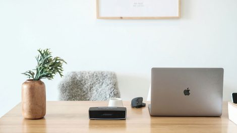 macbook pro on brown wooden table